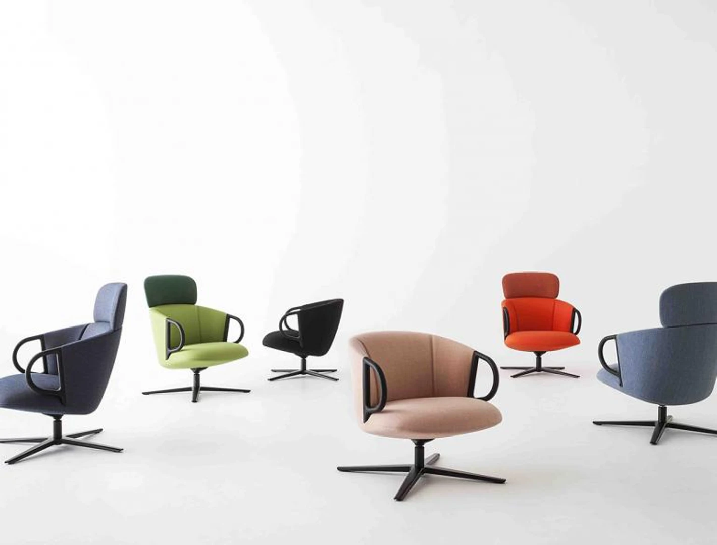 Modern upholstered lounge chair in grey fabric with black armrests and wooden legs