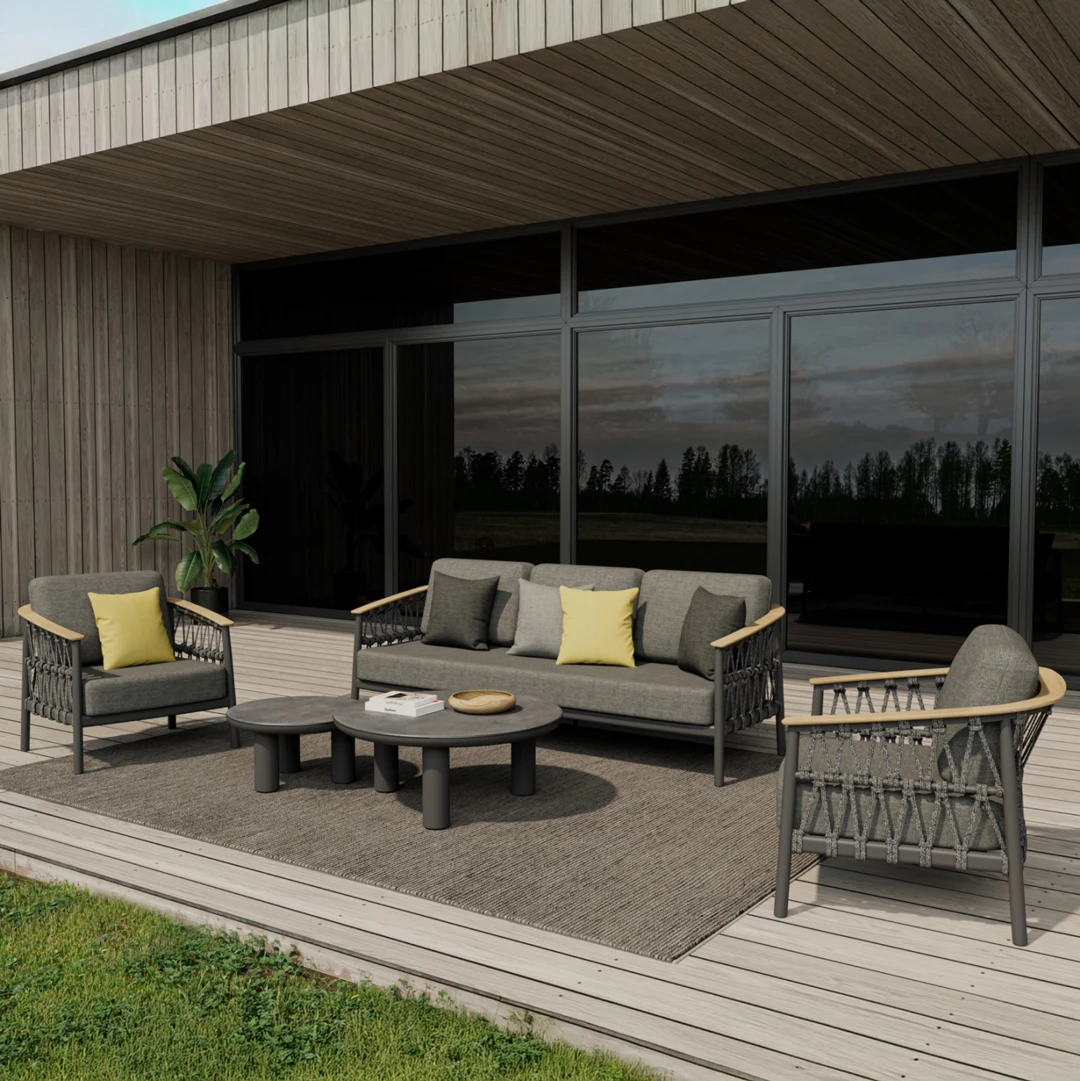 Modern outdoor sofa set with chairs and tables on a wooden deck.
