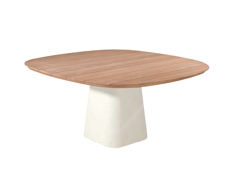 Tiago 160x160 cm outdoor dining table with a natural teak wood top and cement-look pedestal base, styled in a stone courtyard with a natural stone wall.